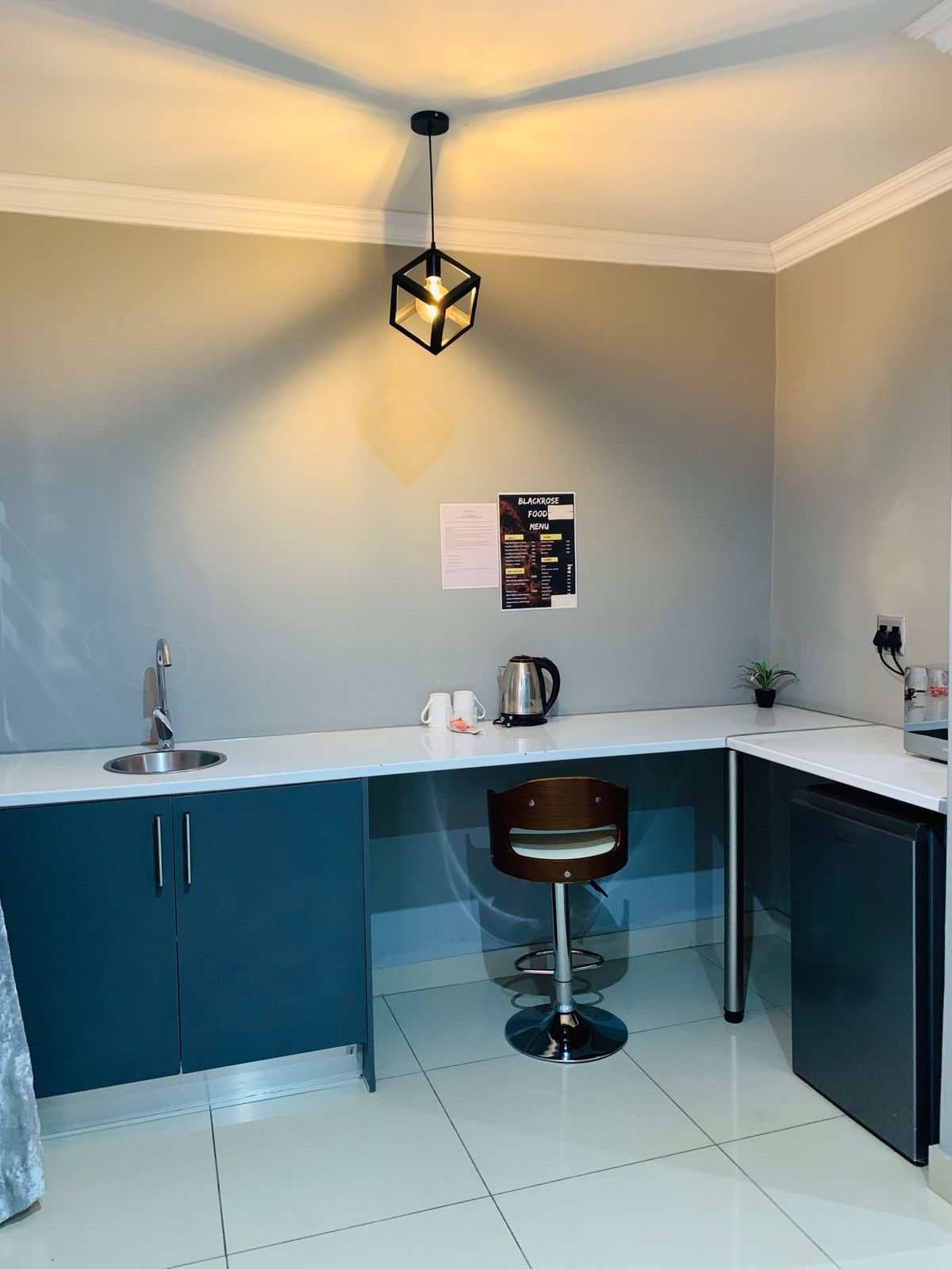 Tea and coffee station with kettle and supplies in standard room