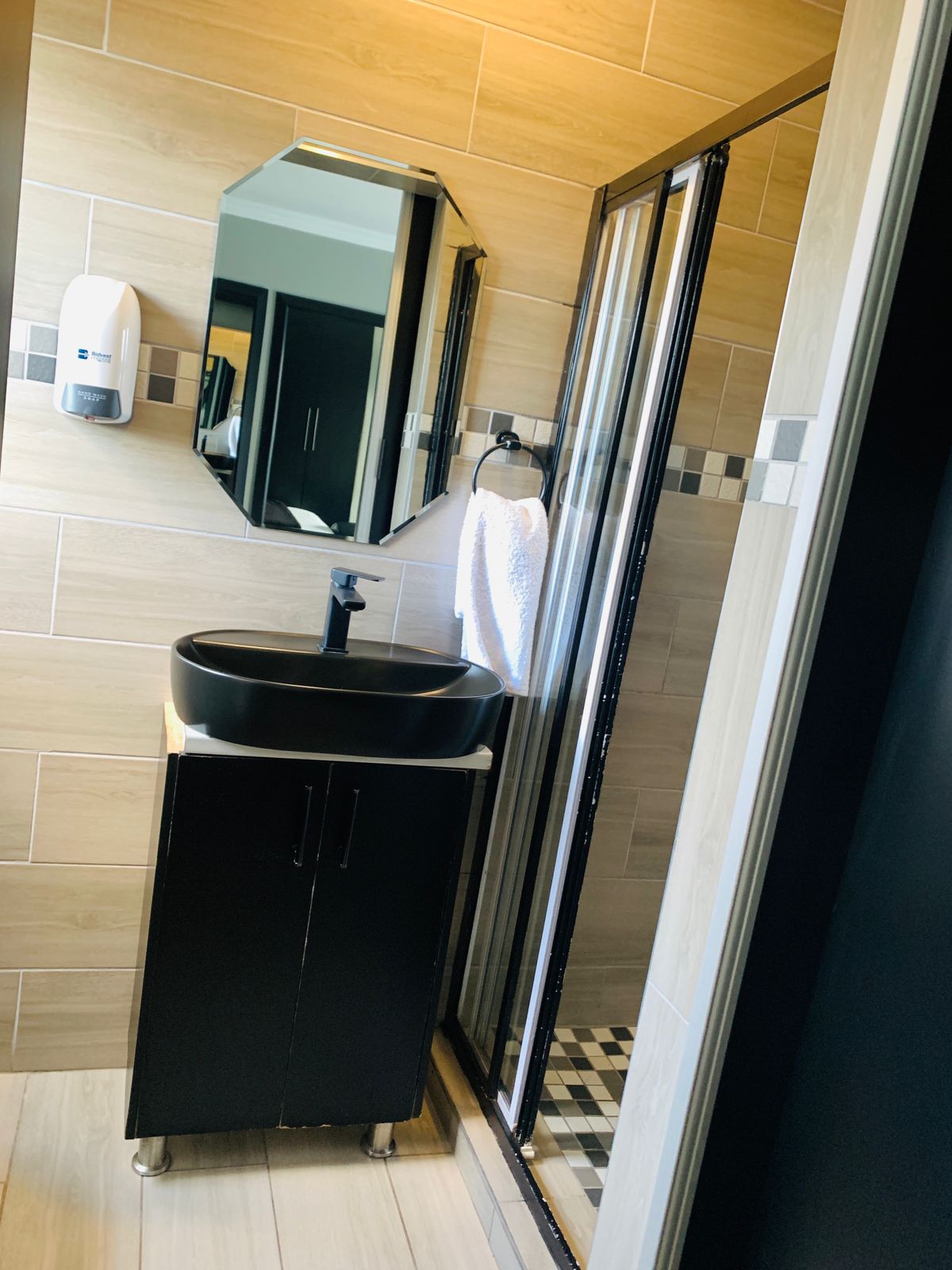 Private en-suite shower in VIP room with modern fixtures