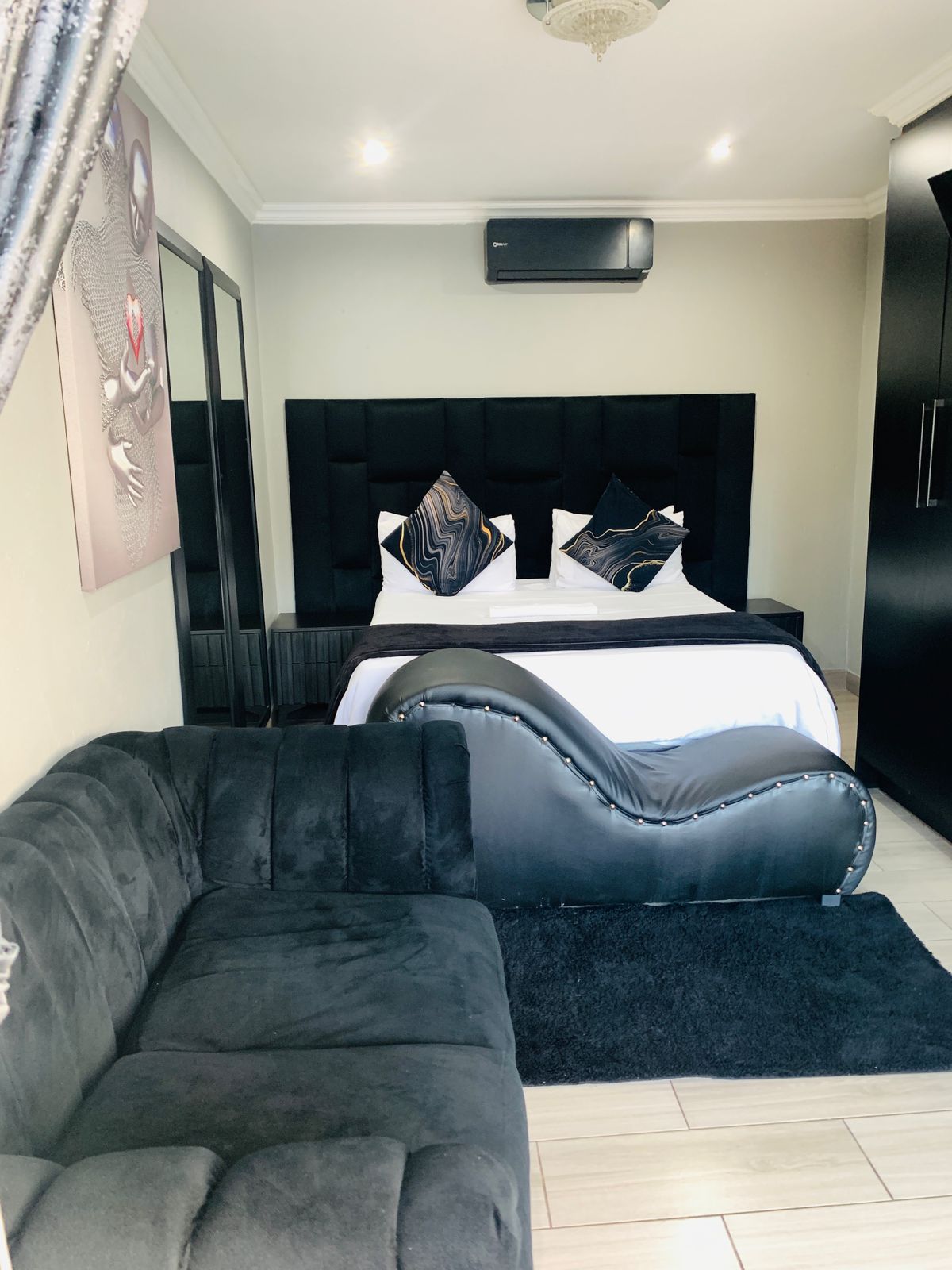 Exclusive VIP room with luxury couch and premium furnishings at Black Rose Guest House